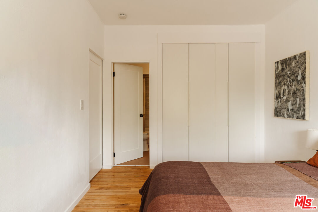 6457 Tokay Road Tujunga, CA 91042 - Photo 12 of 53 a bedroom with a bed and a painting on the wall