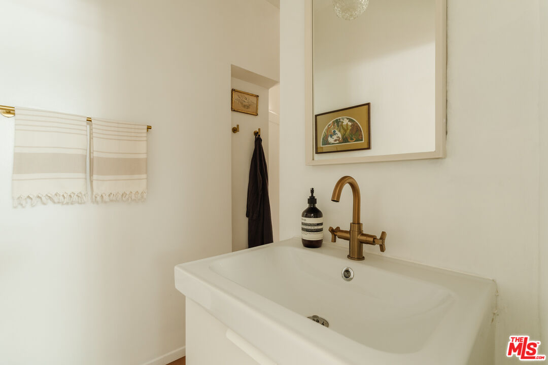 6457 Tokay Road Tujunga, CA 91042 - Photo 13 of 53 a bathroom with a sink and a mirror