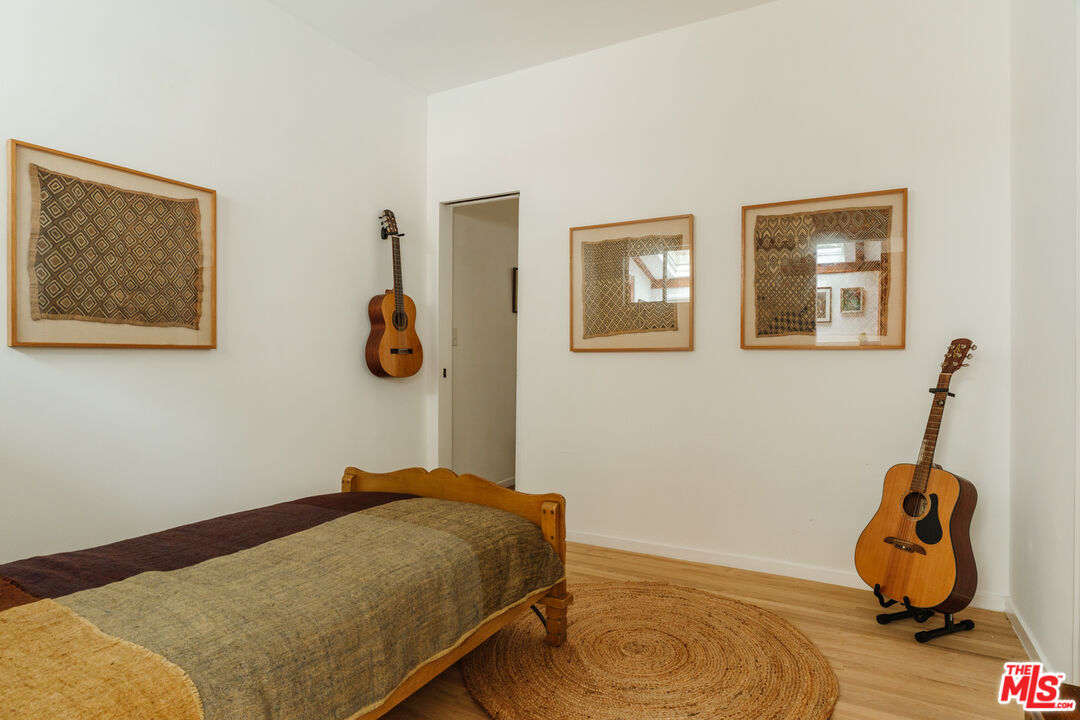 6457 Tokay Road Tujunga, CA 91042 - Photo 33 of 53 a bedroom with a bed and wooden floor