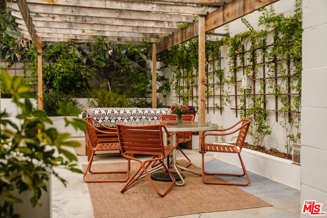 6457 Tokay Road Tujunga, CA 91042 - Photo 39 of 53 a patio with table and chairs and potted plants