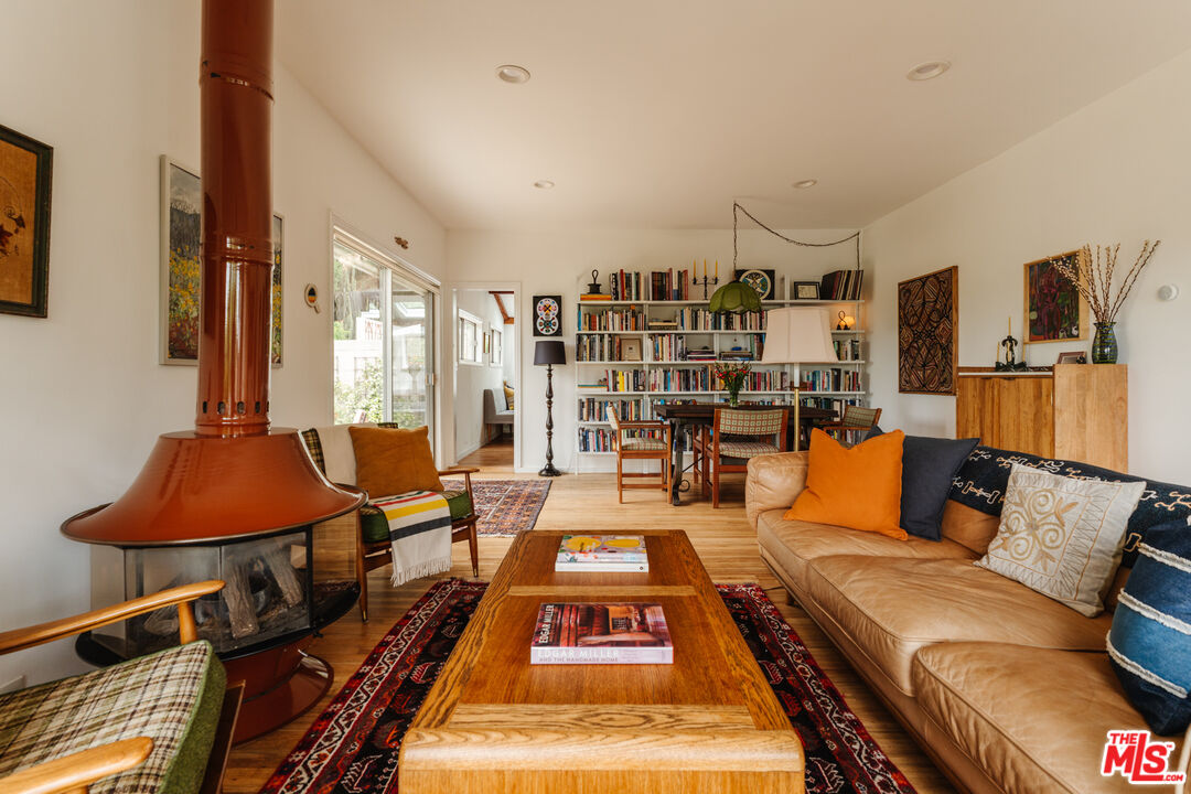 6457 Tokay Road Tujunga, CA 91042 - Photo 4 of 53 a living room with furniture a rug and a chandelier