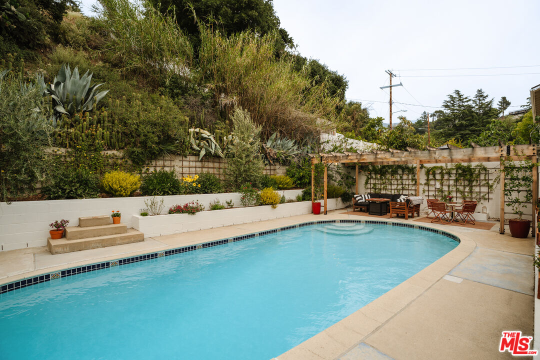 6457 Tokay Road Tujunga, CA 91042 - Photo 41 of 53 a view of swimming pool with seating area and trees around