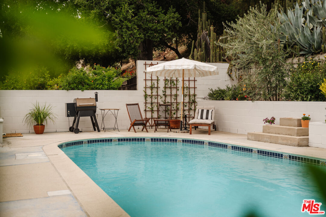 6457 Tokay Road Tujunga, CA 91042 - Photo 42 of 53 a view of a swimming pool with a patio and a yard