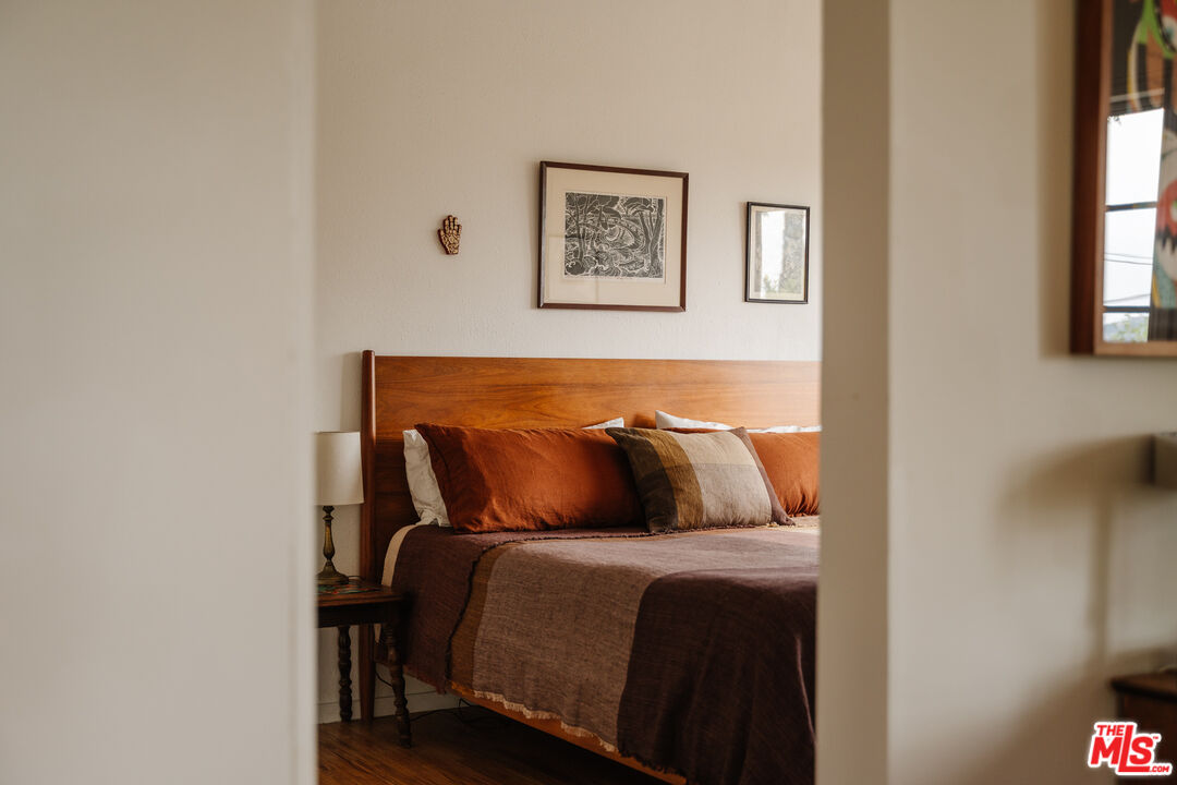 6457 Tokay Road Tujunga, CA 91042 - Photo 9 of 53 a bed sitting in a bedroom next to a window