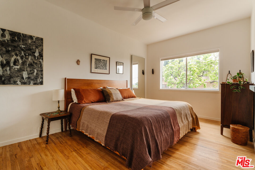 6457 Tokay Road Tujunga, CA 91042 - Photo 10 of 53 a bedroom with a bed and wooden floor