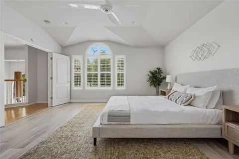 a bedroom with a large bed and a window