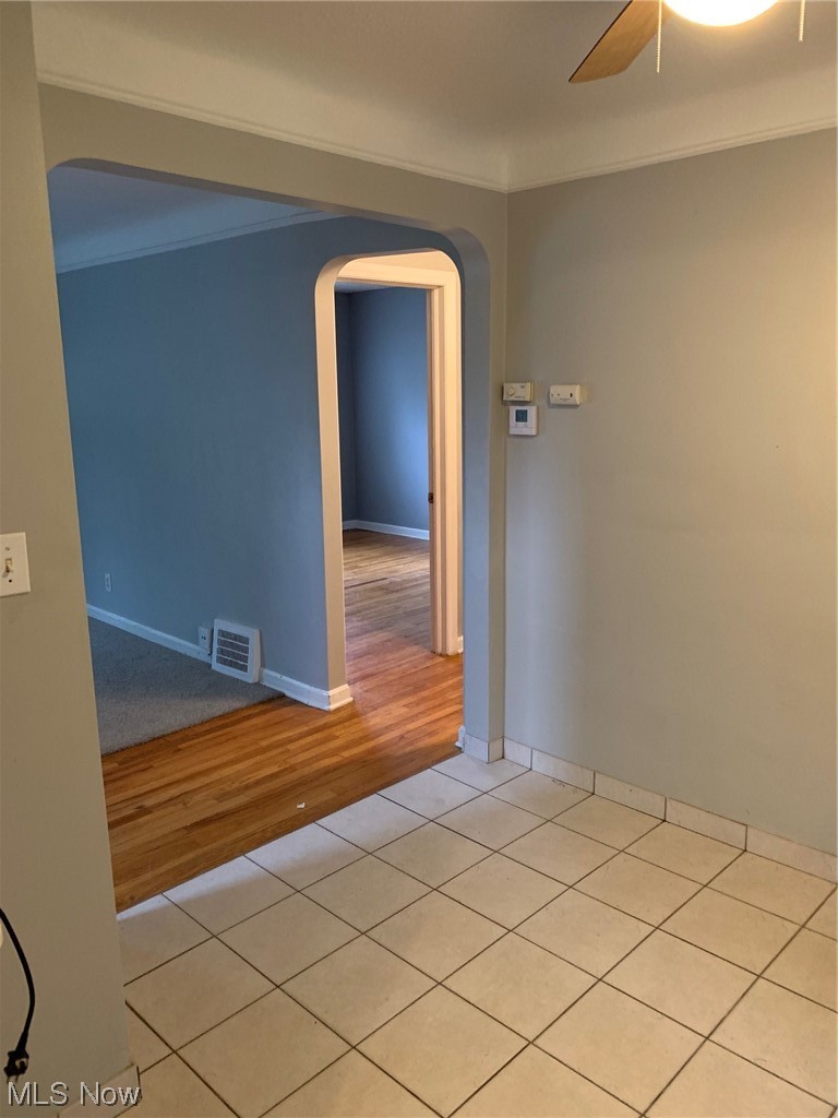 1287 Churchill Road Lyndhurst, OH 44124 - Photo 15 of 27 Tiled spare room featuring ceiling fan and crown molding