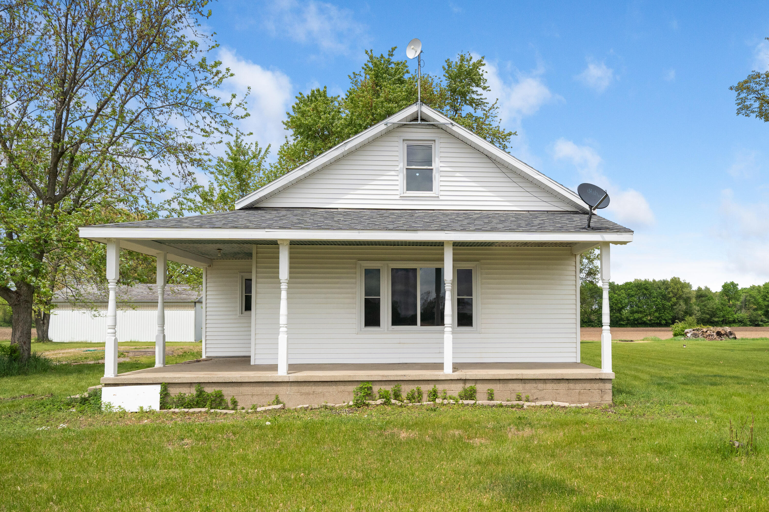 19610 14b Road Culver, IN 46511 - Photo 1 of 23 a front view of a house with a yard
