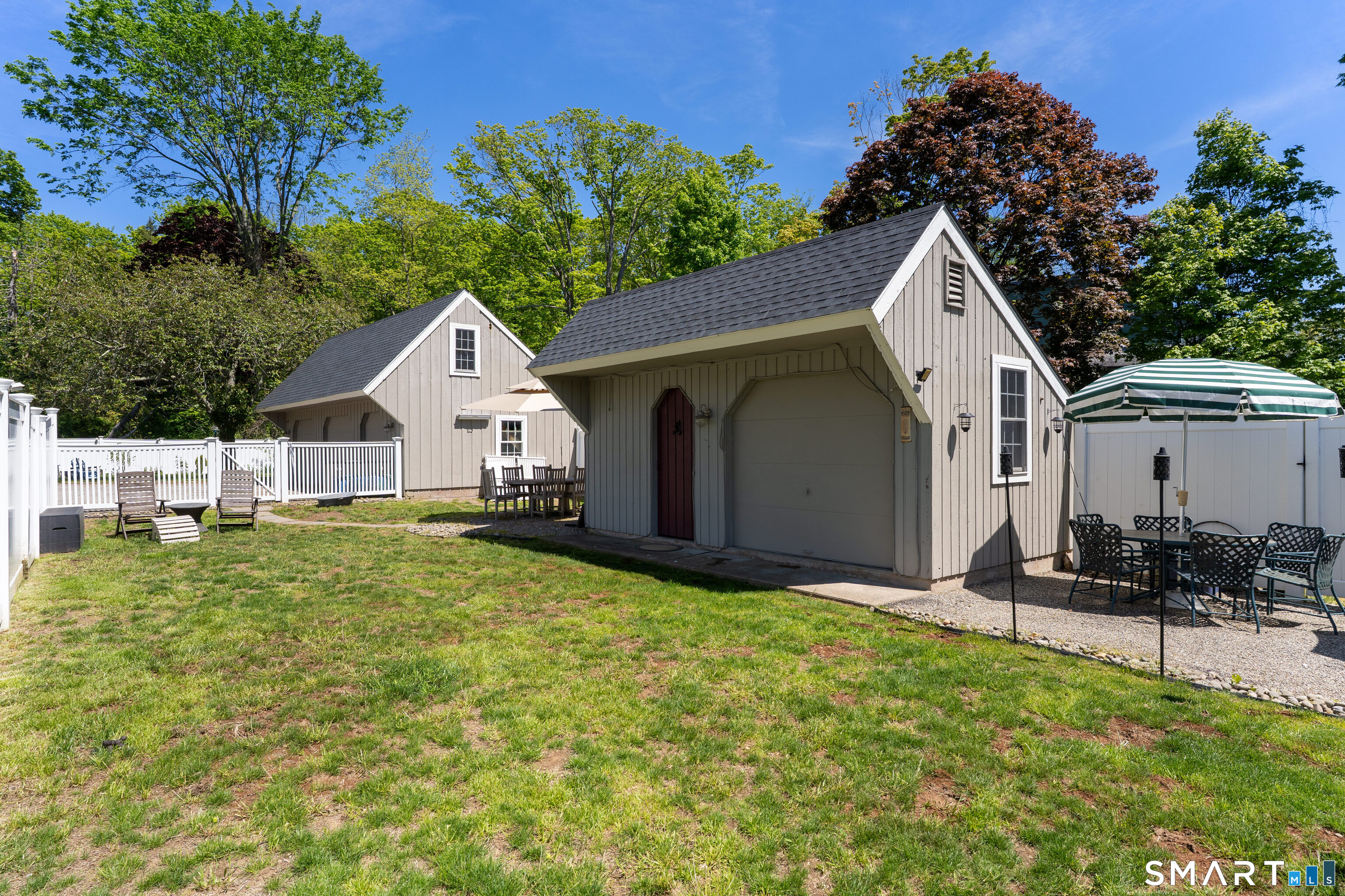 147 Boston Street Guilford, CT 06437 - Photo 37 of 38 a view of a backyard with sitting area