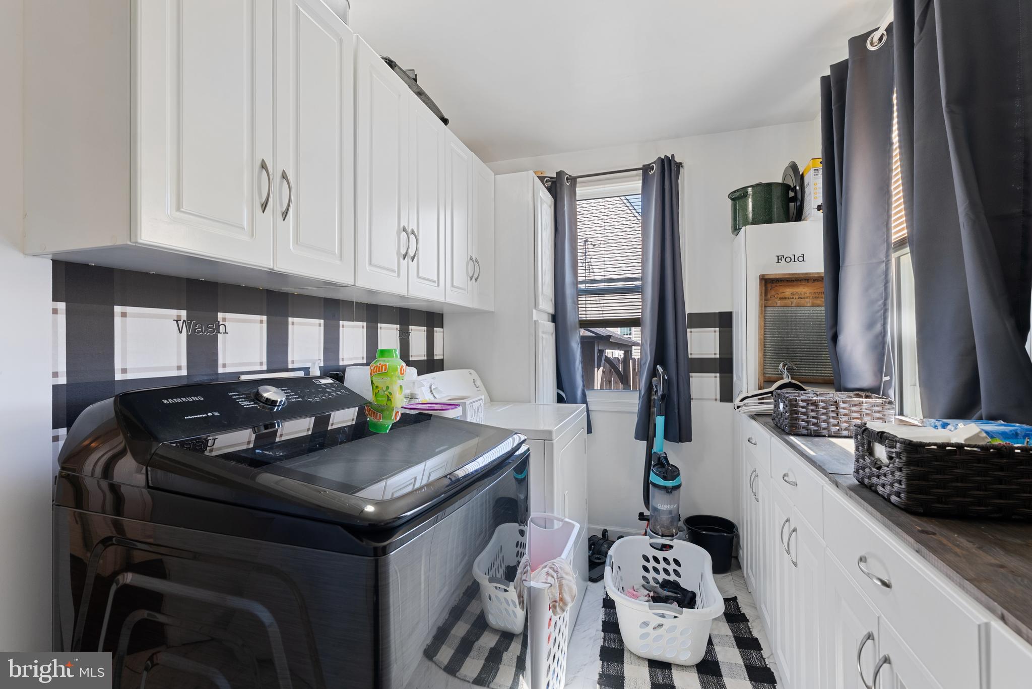 70 Del Rio Road Baltimore, MD 21222 - Photo 14 of 40 a kitchen with stainless steel appliances granite countertop a stove white cabinets a sink and dishwasher