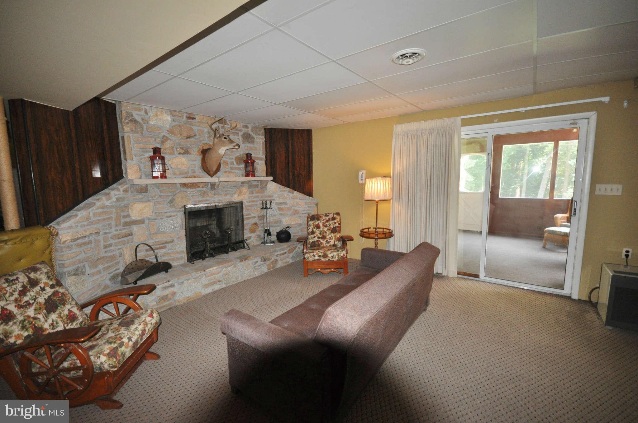 2711 Parkshire Drive Fallston, MD 21047 - Photo 22 of 30 a living room with furniture and a fireplace