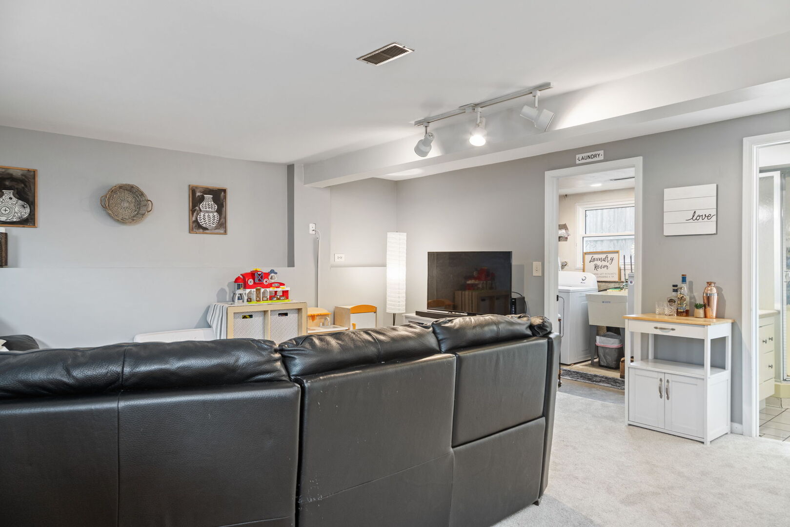 1N264 Darling Street Carol Stream, IL 60188 - Photo 22 of 30 a living room with furniture and a flat screen tv