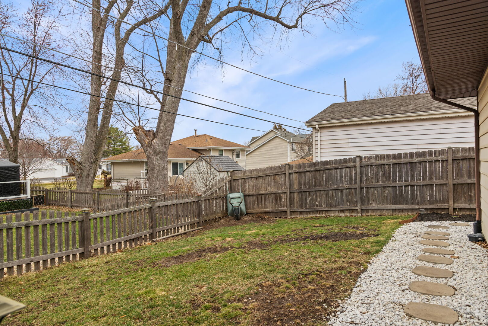 1N264 Darling Street Carol Stream, IL 60188 - Photo 27 of 30 a view of a house with a small yard and wooden fence