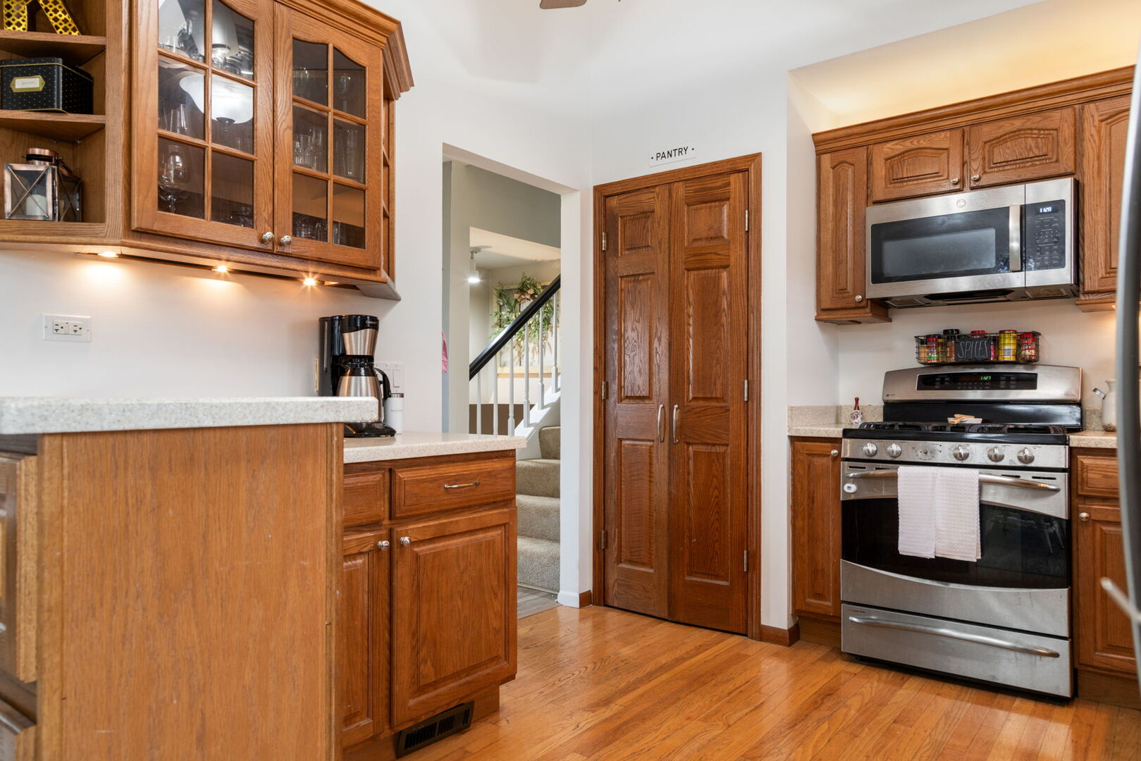 1N264 Darling Street Carol Stream, IL 60188 - Photo 7 of 30 a kitchen with stainless steel appliances granite countertop a refrigerator and a stove top oven