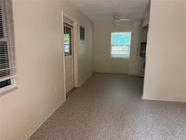 a view of a closet with wooden floor