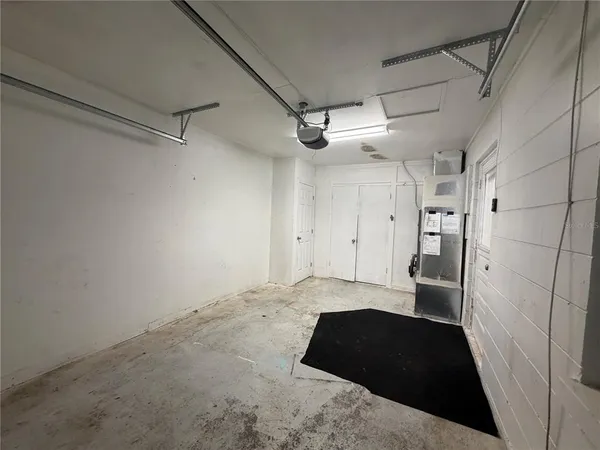 a view of a closet with wooden floor