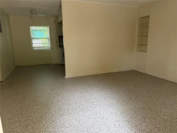 an empty room with closet area