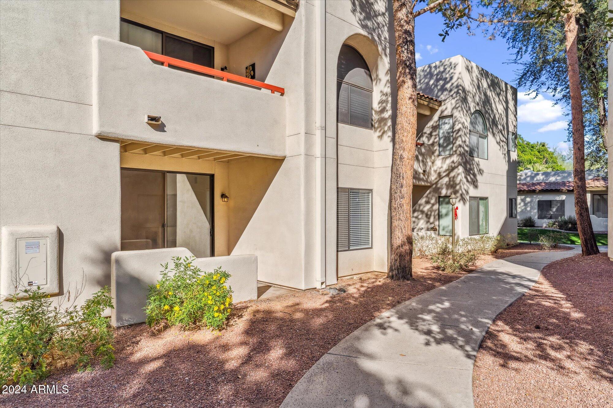 750 East Northern Avenue, Unit 1089 Phoenix, AZ 85020 - Photo 14 of 36 a front view of a house with a yard