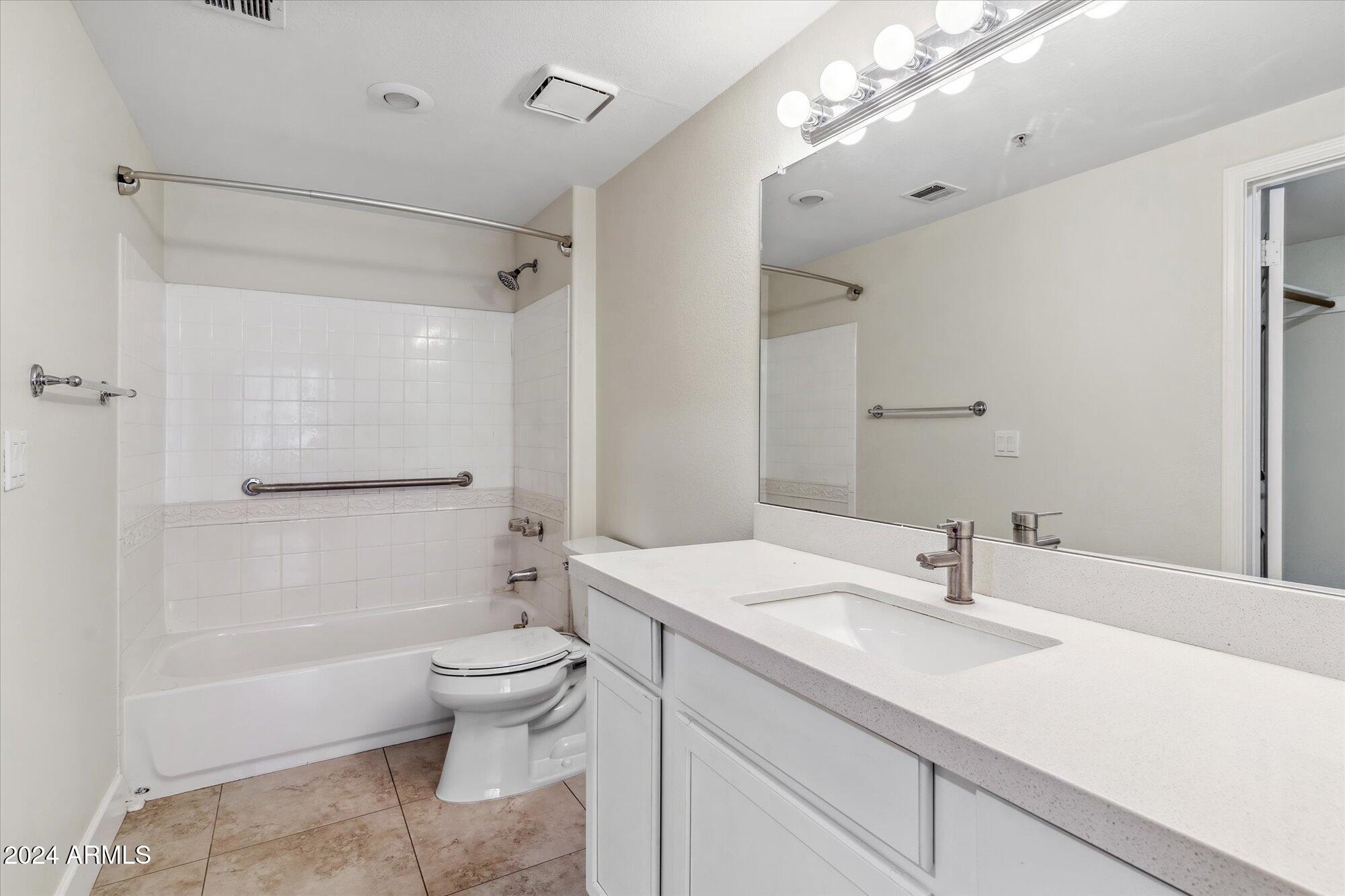 750 East Northern Avenue, Unit 1089 Phoenix, AZ 85020 - Photo 17 of 36 a bathroom with a sink a toilet and shower