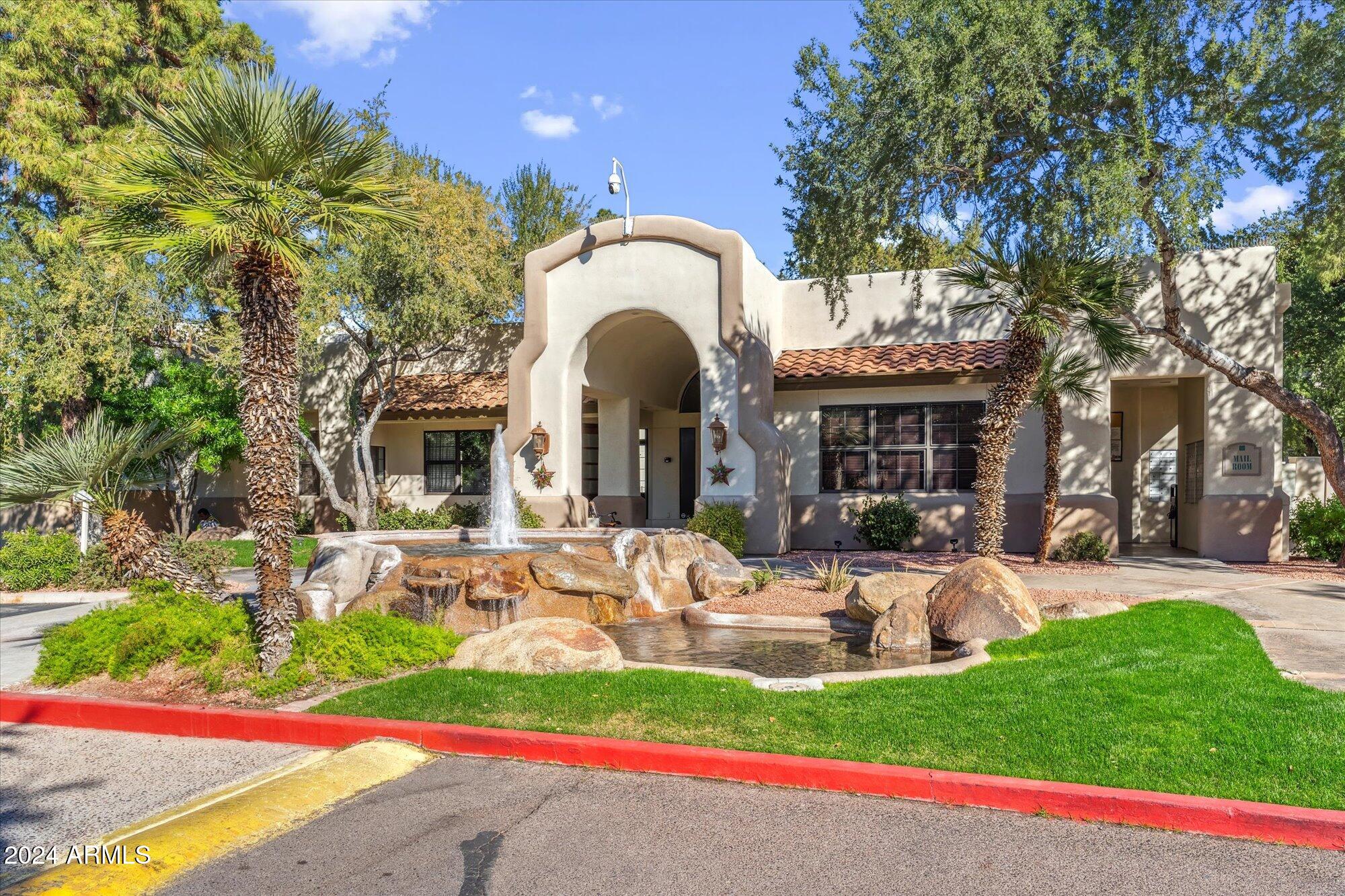 750 East Northern Avenue, Unit 1089 Phoenix, AZ 85020 - Photo 26 of 36 a front view of a house with garden and patio