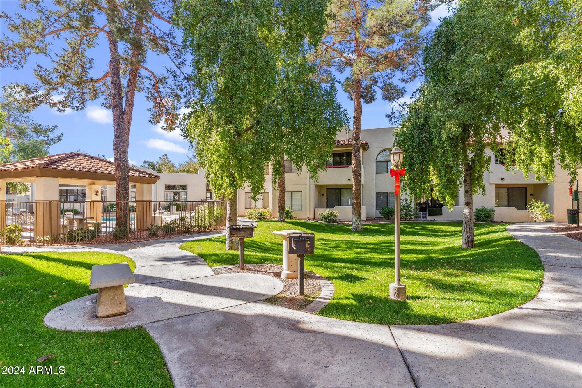 750 East Northern Avenue, Unit 1089 Phoenix, AZ 85020 - Photo 27 of 36 a view of a house with a swimming pool and porch