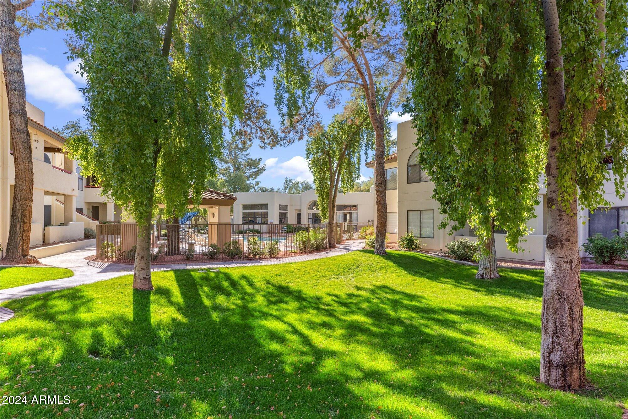 750 East Northern Avenue, Unit 1089 Phoenix, AZ 85020 - Photo 28 of 36 a view of a house with a yard