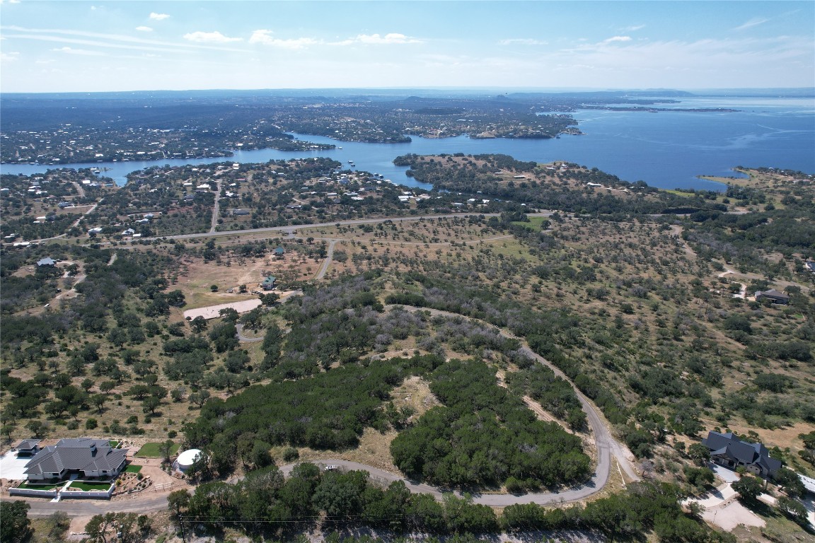 an aerial view of house with ocean view