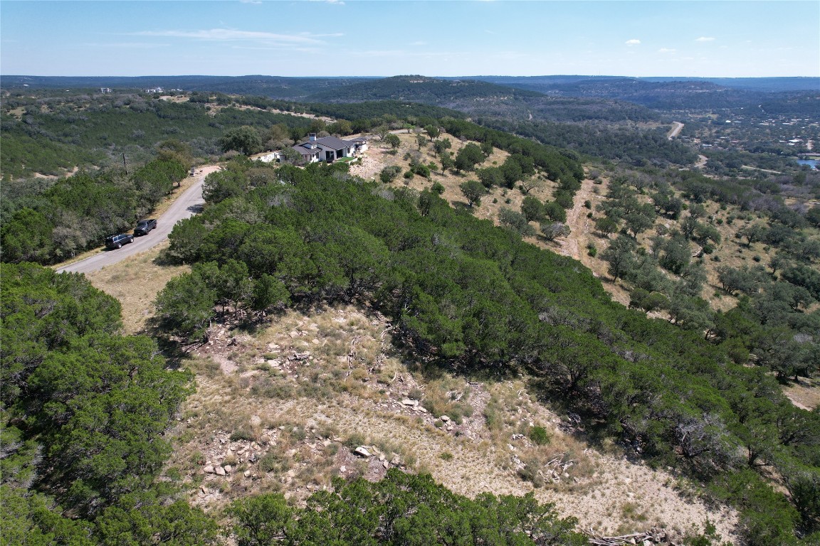 Rr-2 Wolf Creek Ranch Road Burnet, TX 78611 - Photo 5 of 15 an aerial view of residential house with green space and mountain view in back