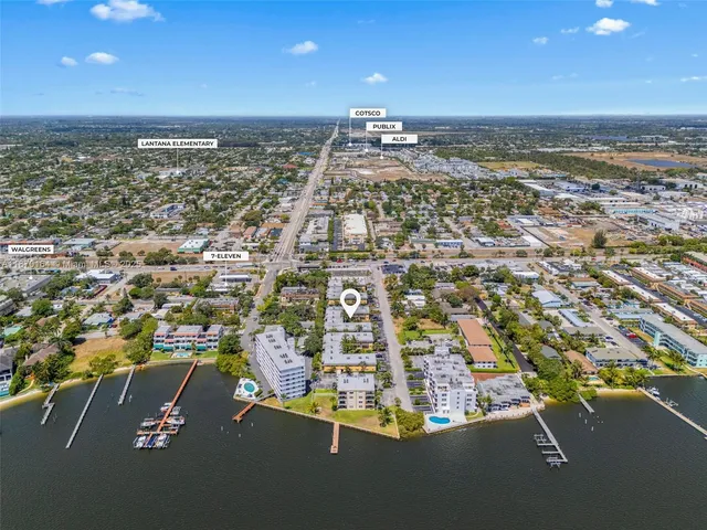 an aerial view of residential building with parking space