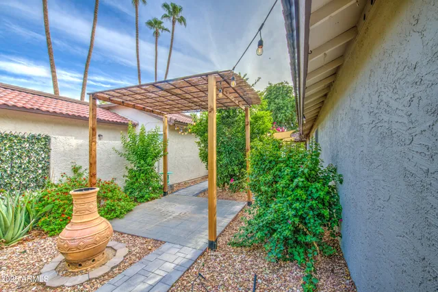 a view of a hallway with a glass door shower