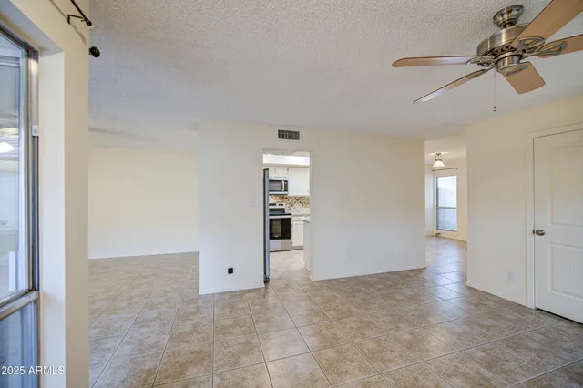 a kitchen with a refrigerator and a sink
