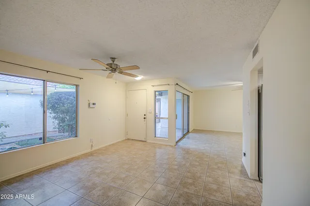 a kitchen with granite countertop a sink and cabinets