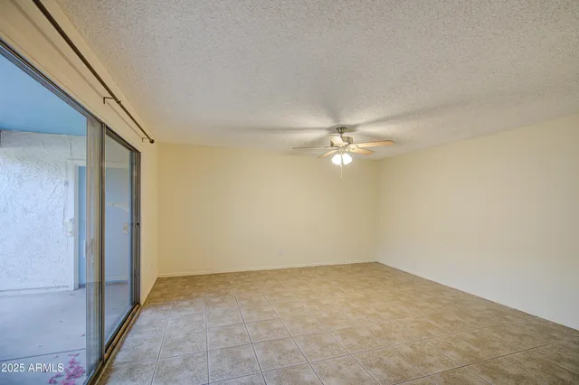 a bathroom with a granite countertop toilet sink and mirror