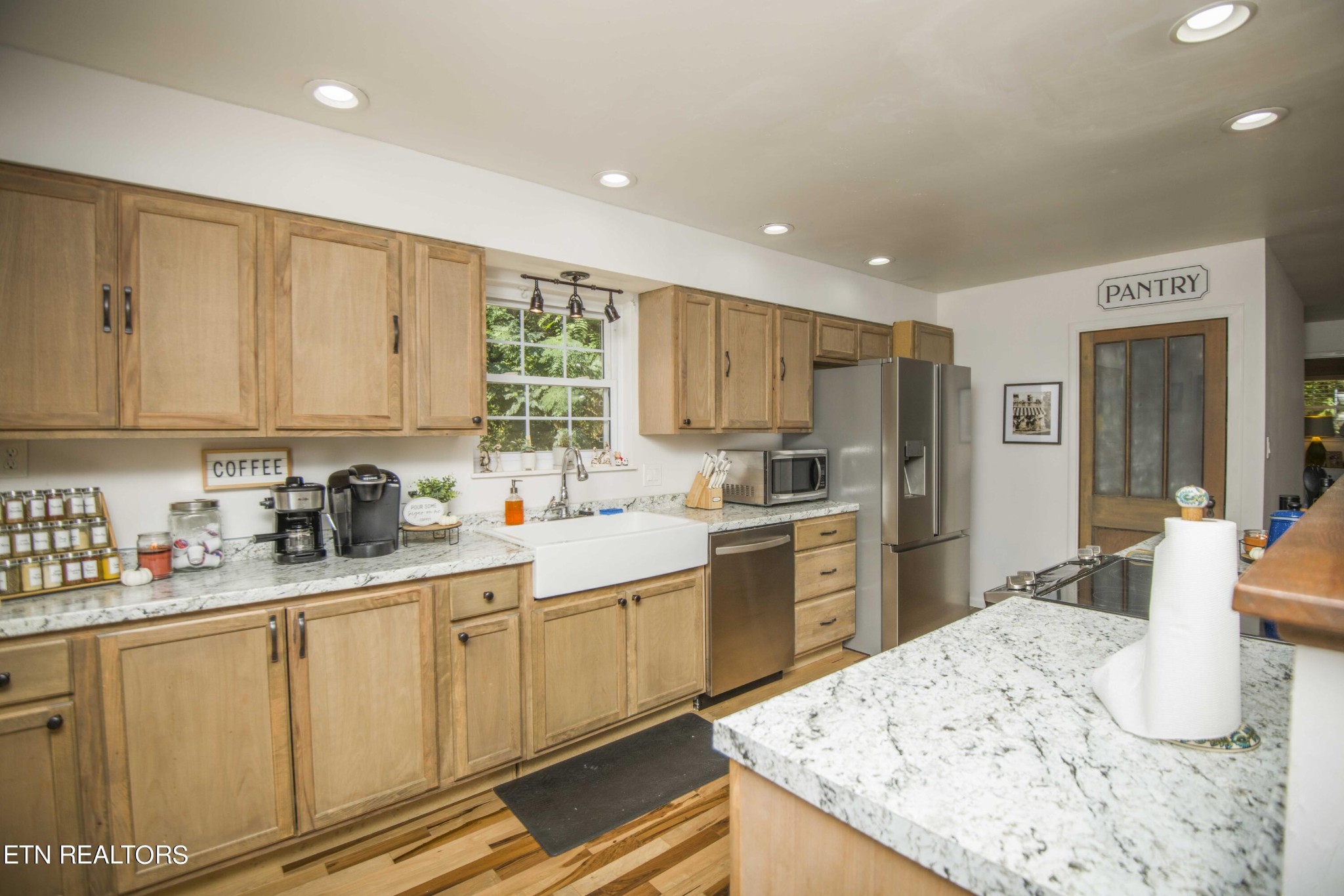 329 Hidden Valley Road Clinton, TN 37716 - Photo 3 of 29 a kitchen with white cabinets sink and refrigerator