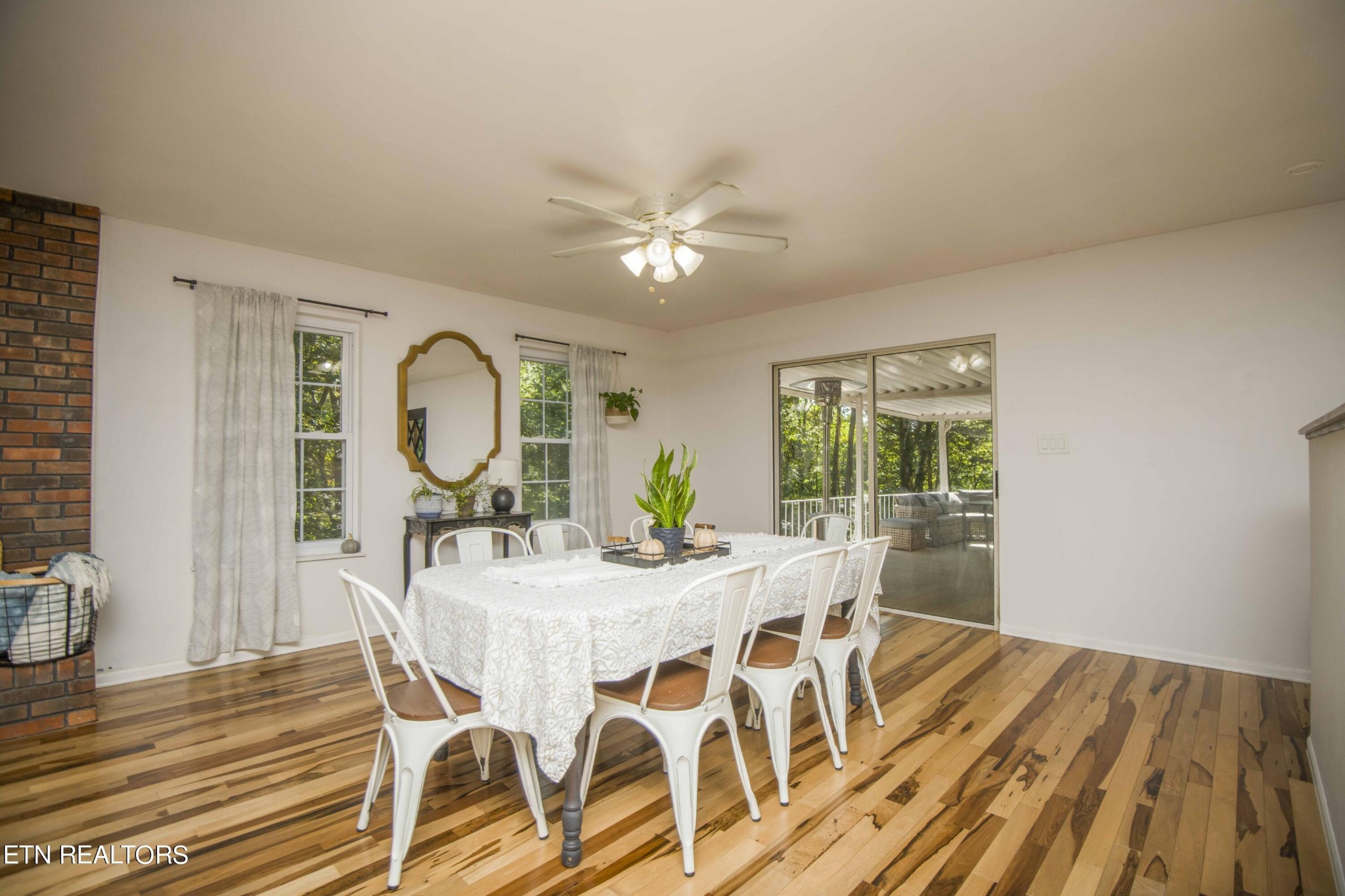 329 Hidden Valley Road Clinton, TN 37716 - Photo 5 of 29 a view of a dining room with furniture window and wooden floor