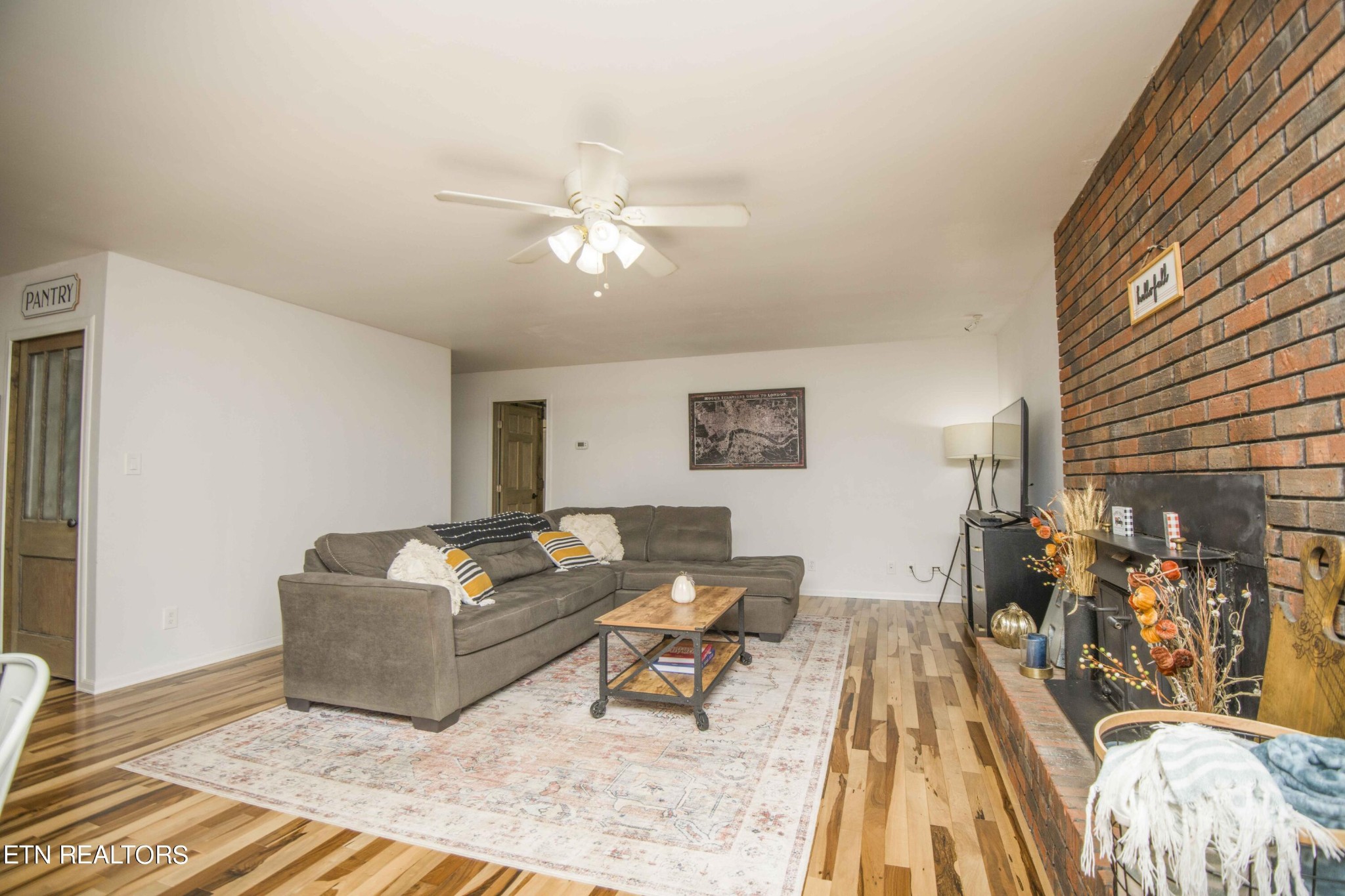 329 Hidden Valley Road Clinton, TN 37716 - Photo 6 of 29 a living room with furniture and wooden floor