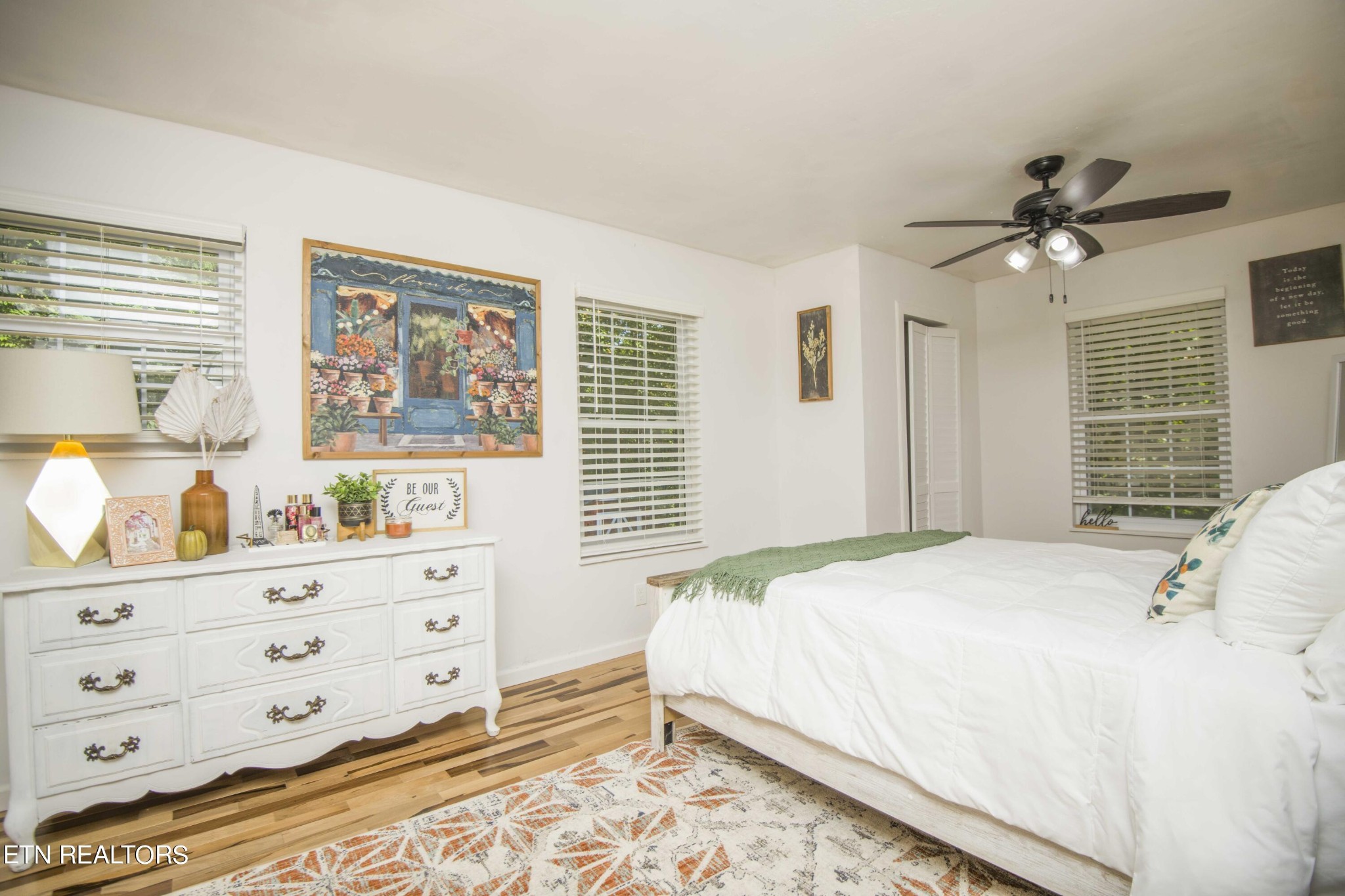 329 Hidden Valley Road Clinton, TN 37716 - Photo 9 of 29 a bedroom with a bed and a dresser in it