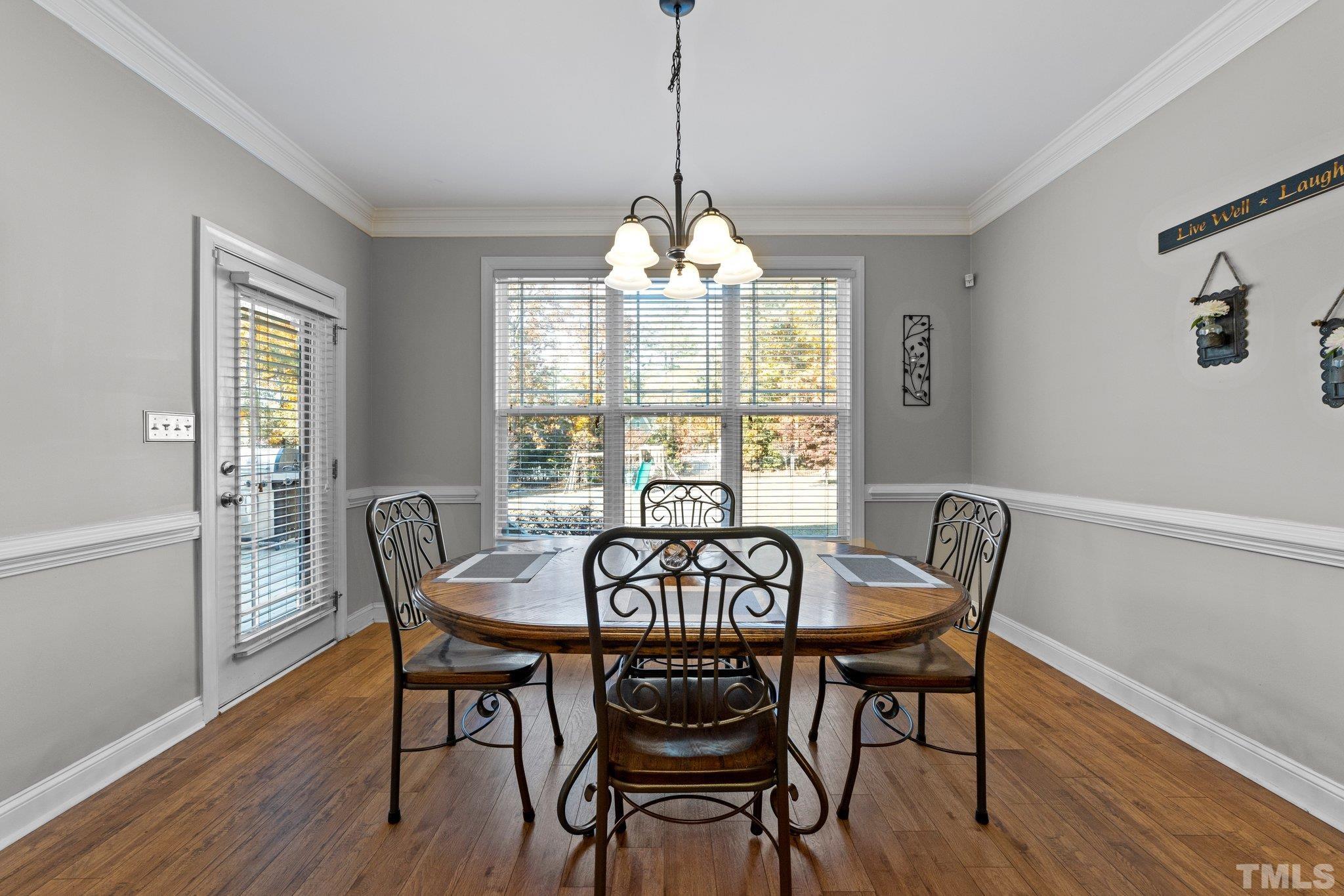 270 Timberland Drive Angier, NC 27501 - Photo 11 of 30 a view of a dining room with furniture window and wooden floor
