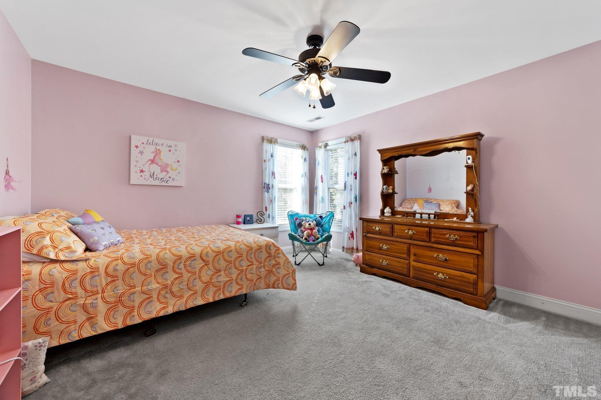 270 Timberland Drive Angier, NC 27501 - Photo 20 of 30 a bed room with a bed and a television