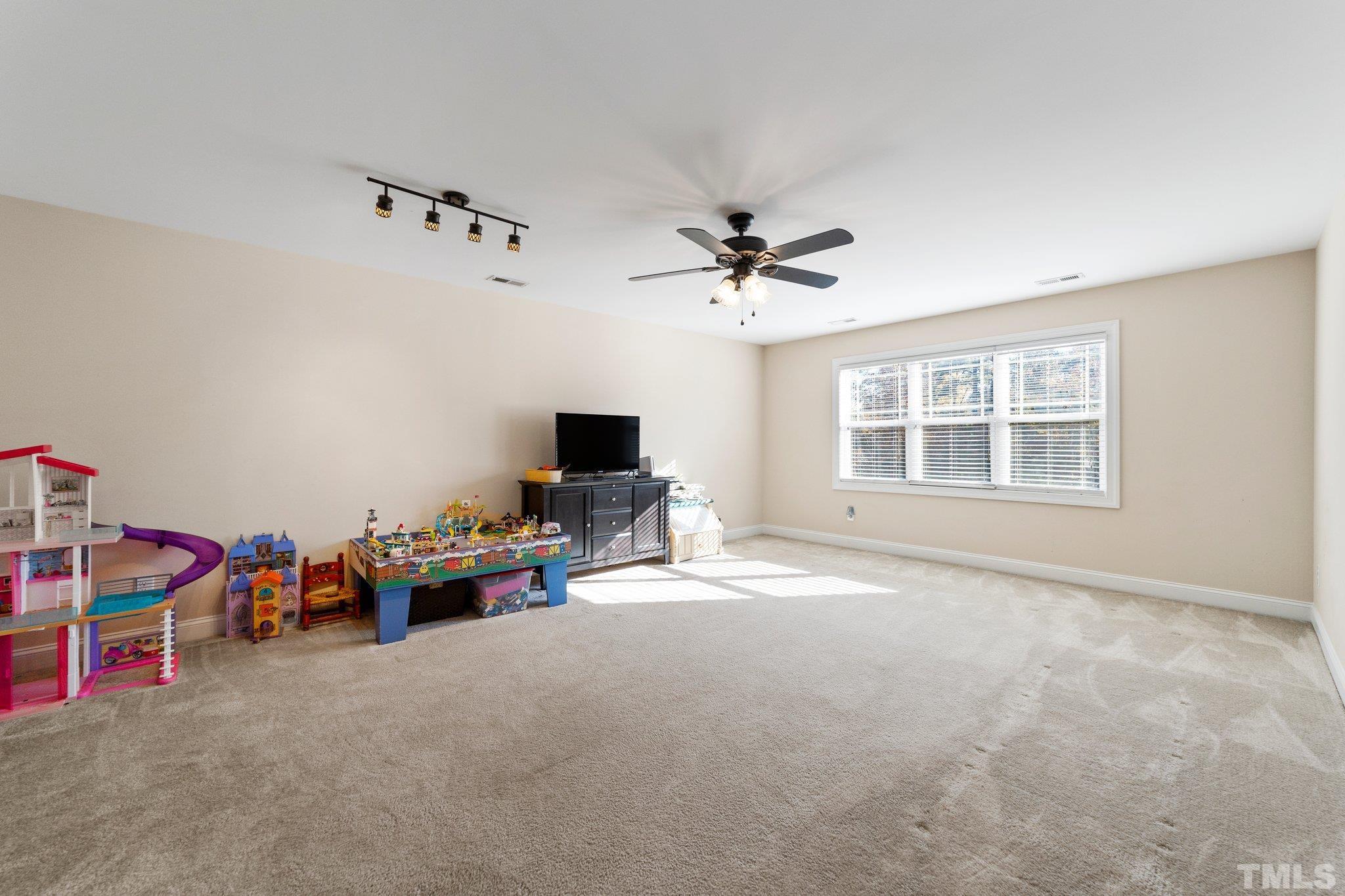270 Timberland Drive Angier, NC 27501 - Photo 21 of 30 a living room with furniture and a flat screen tv