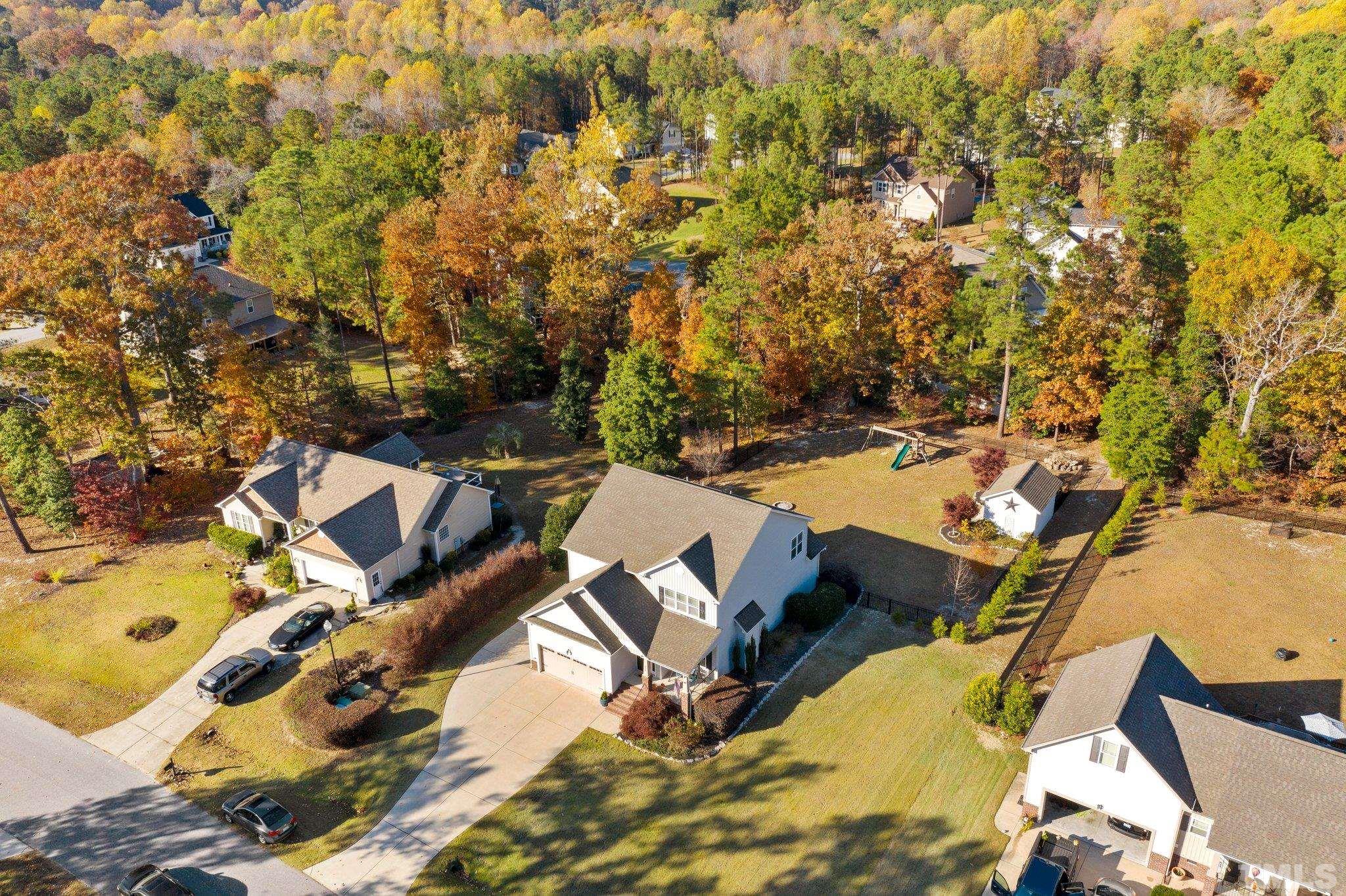 270 Timberland Drive Angier, NC 27501 - Photo 27 of 30 an aerial view of a house with swimming pool and lawn chairs