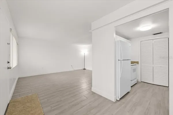 a view of a livingroom with wooden floor