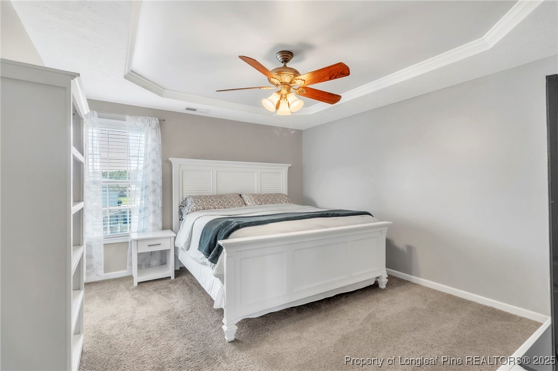 665 Cape Fear Road Raeford, NC 28376 - Photo 17 of 33 a bedroom with a bed and a window