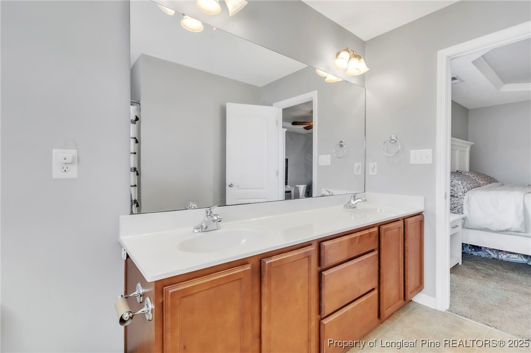 665 Cape Fear Road Raeford, NC 28376 - Photo 20 of 33 a bathroom with a sink and a mirror