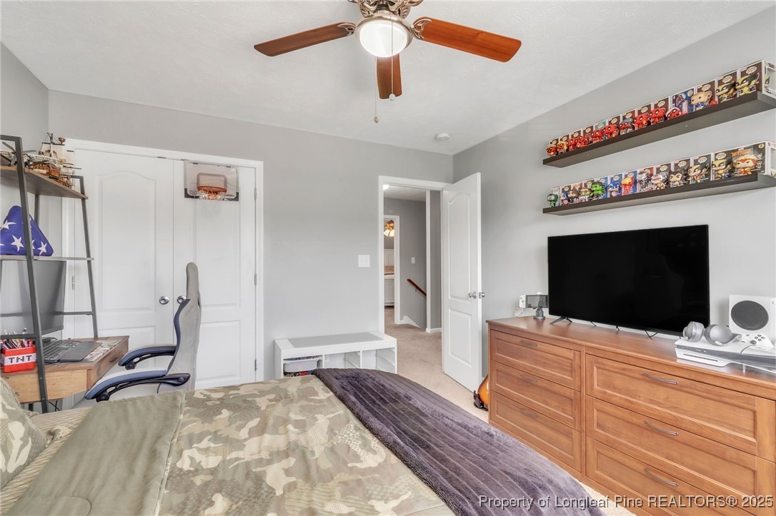 665 Cape Fear Road Raeford, NC 28376 - Photo 24 of 33 a bedroom with a bed and a flat screen tv