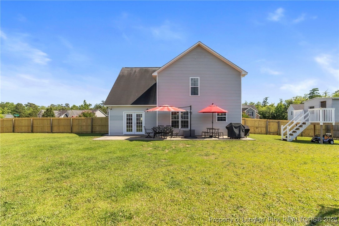 665 Cape Fear Road Raeford, NC 28376 - Photo 30 of 33 a view of a house with pool and a yard