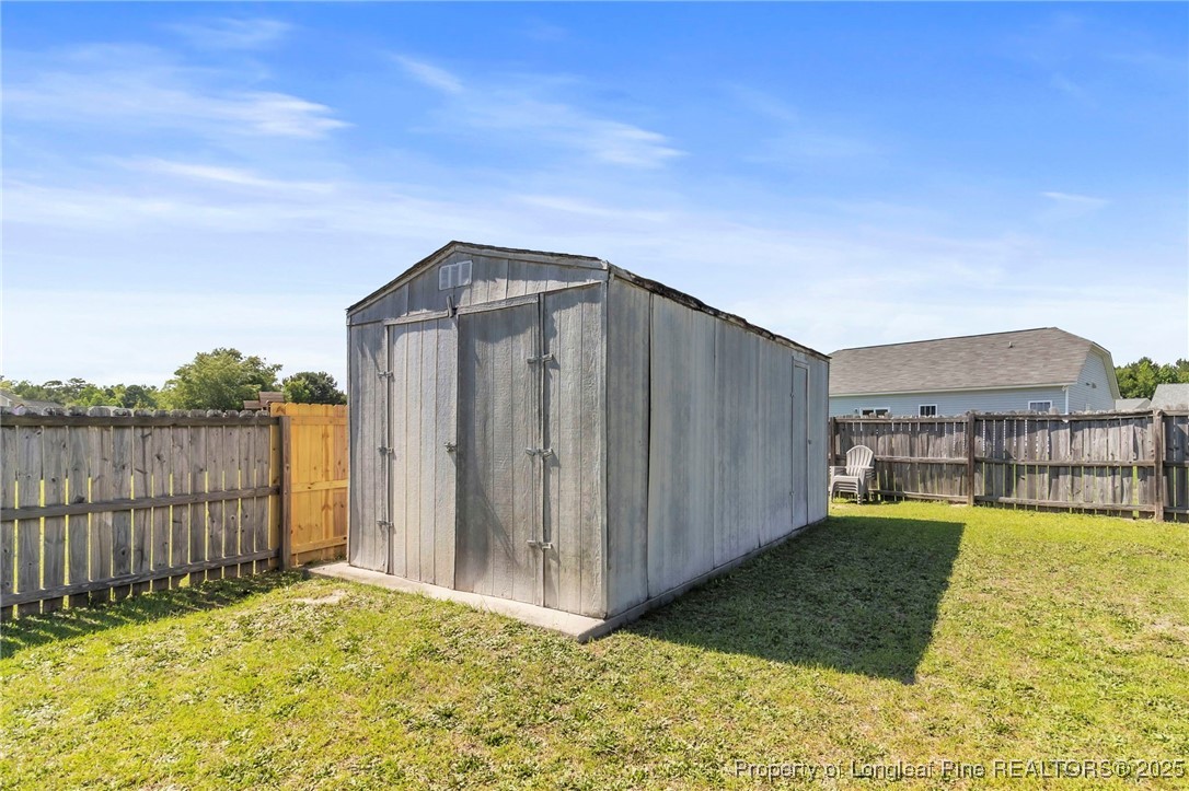 665 Cape Fear Road Raeford, NC 28376 - Photo 32 of 33 a house view with a outdoor space