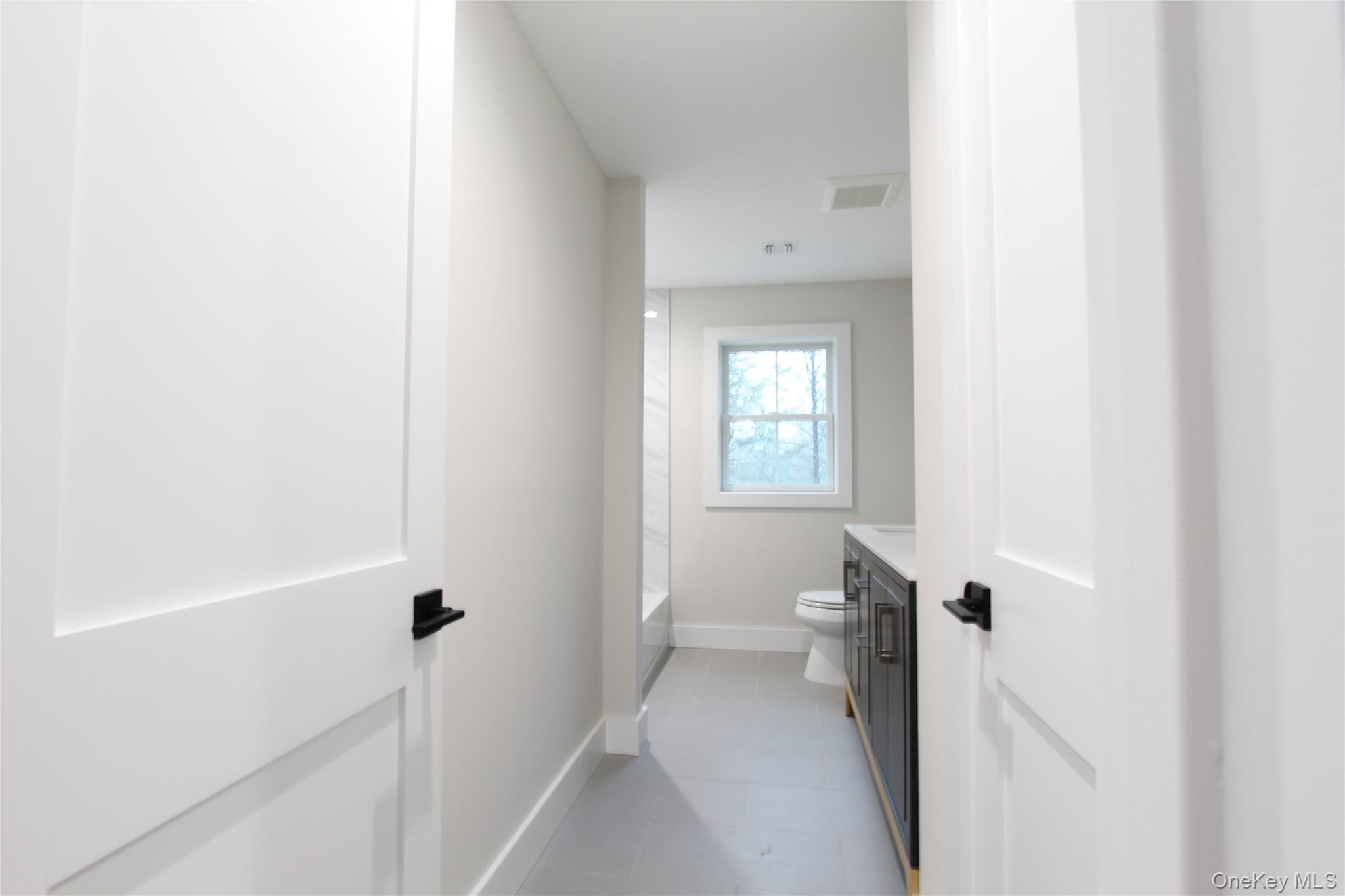 5 Colonels Path Manorville, NY 11949 - Photo 13 of 19 Full bath with vanity and tile patterned flooring