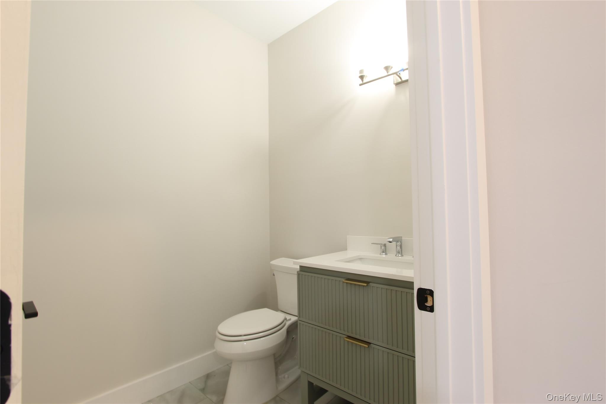 5 Colonels Path Manorville, NY 11949 - Photo 8 of 19 Bathroom with vanity and marble finish flooring