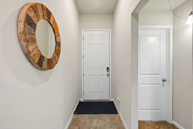 a view of a livingroom from a corridor
